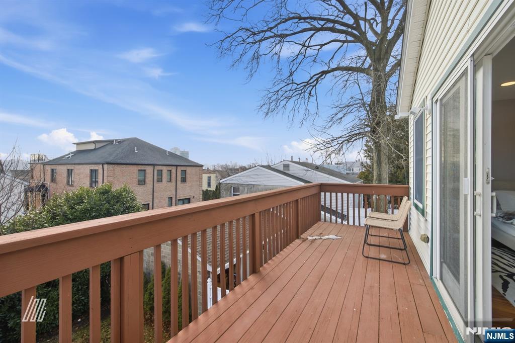 331 Undercliff Avenue Edgewater, NJ 07020 - Photo 25 of 45 a view of a wooden deck with a yard