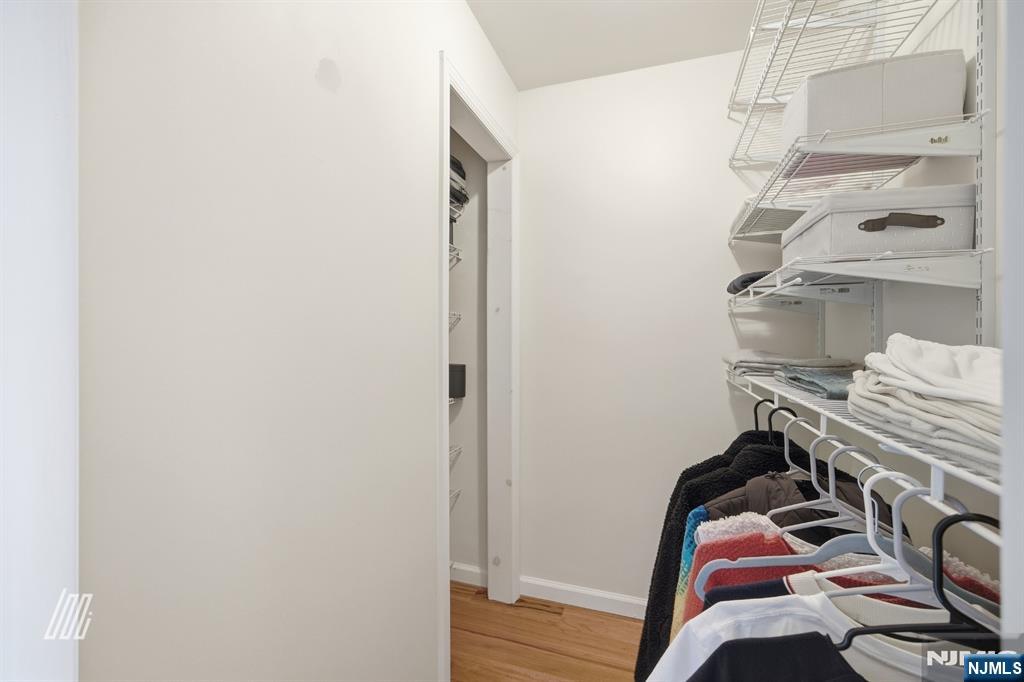 331 Undercliff Avenue Edgewater, NJ 07020 - Photo 29 of 45 a view of walk in closet with clothes and shoes