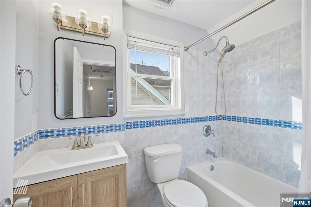 331 Undercliff Avenue Edgewater, NJ 07020 - Photo 32 of 45 a bathroom with a sink toilet and shower