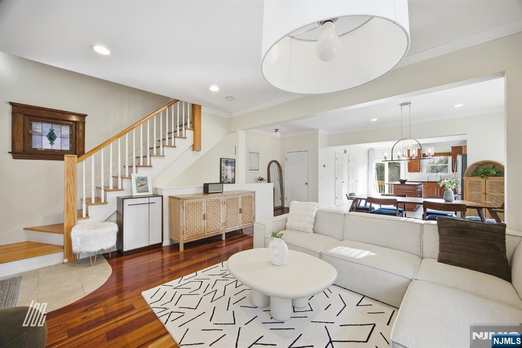 331 Undercliff Avenue Edgewater, NJ 07020 - Photo 7 of 45 a living room with furniture and kitchen view