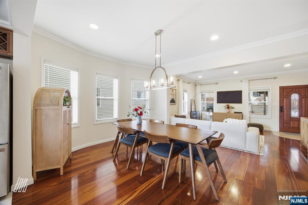 331 Undercliff Avenue Edgewater, NJ 07020 - Photo 10 of 45 a view of a dining room with furniture window and wooden floor