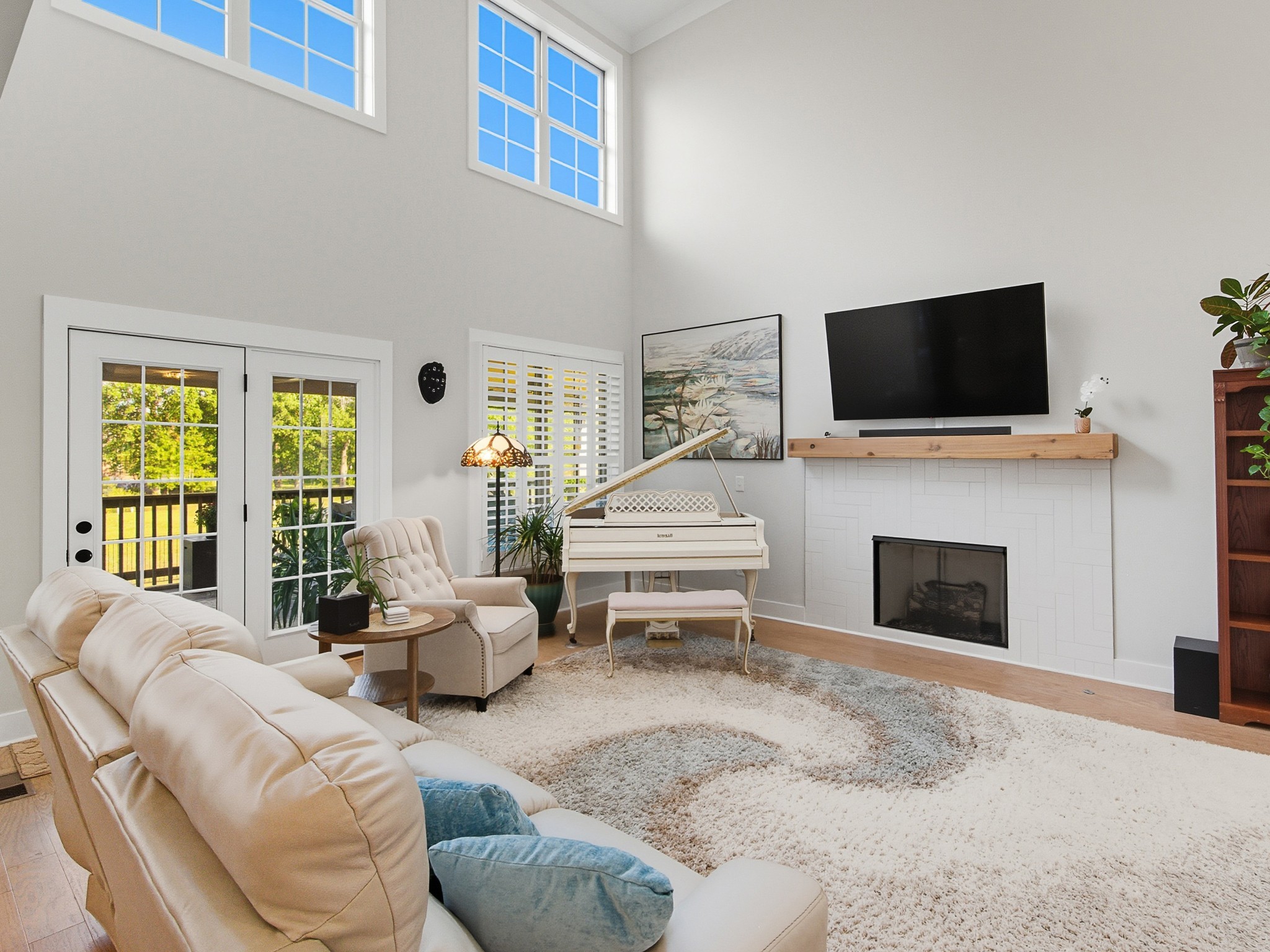 106 Watermill Lane Lebanon, TN 37087 - Photo 15 of 85 a living room with furniture a flat screen tv and a fireplace