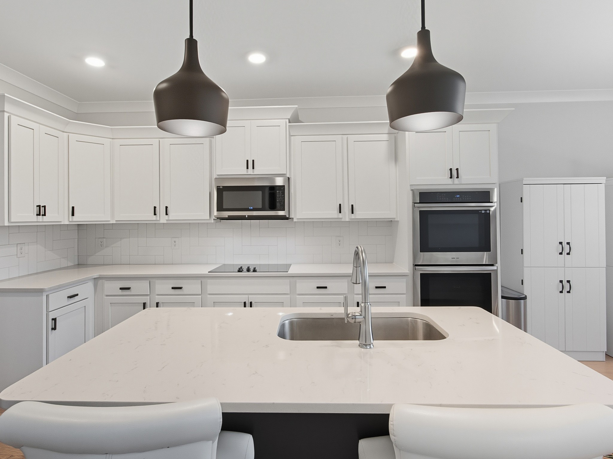 106 Watermill Lane Lebanon, TN 37087 - Photo 21 of 85 a kitchen with stainless steel appliances a stove a sink a microwave and cabinets