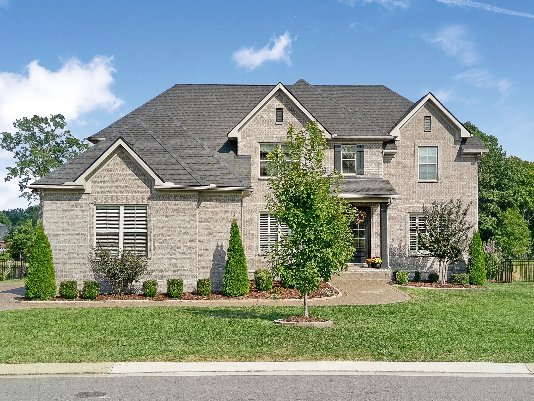 106 Watermill Lane Lebanon, TN 37087 - Photo 4 of 85 a front view of a house with a yard and garage