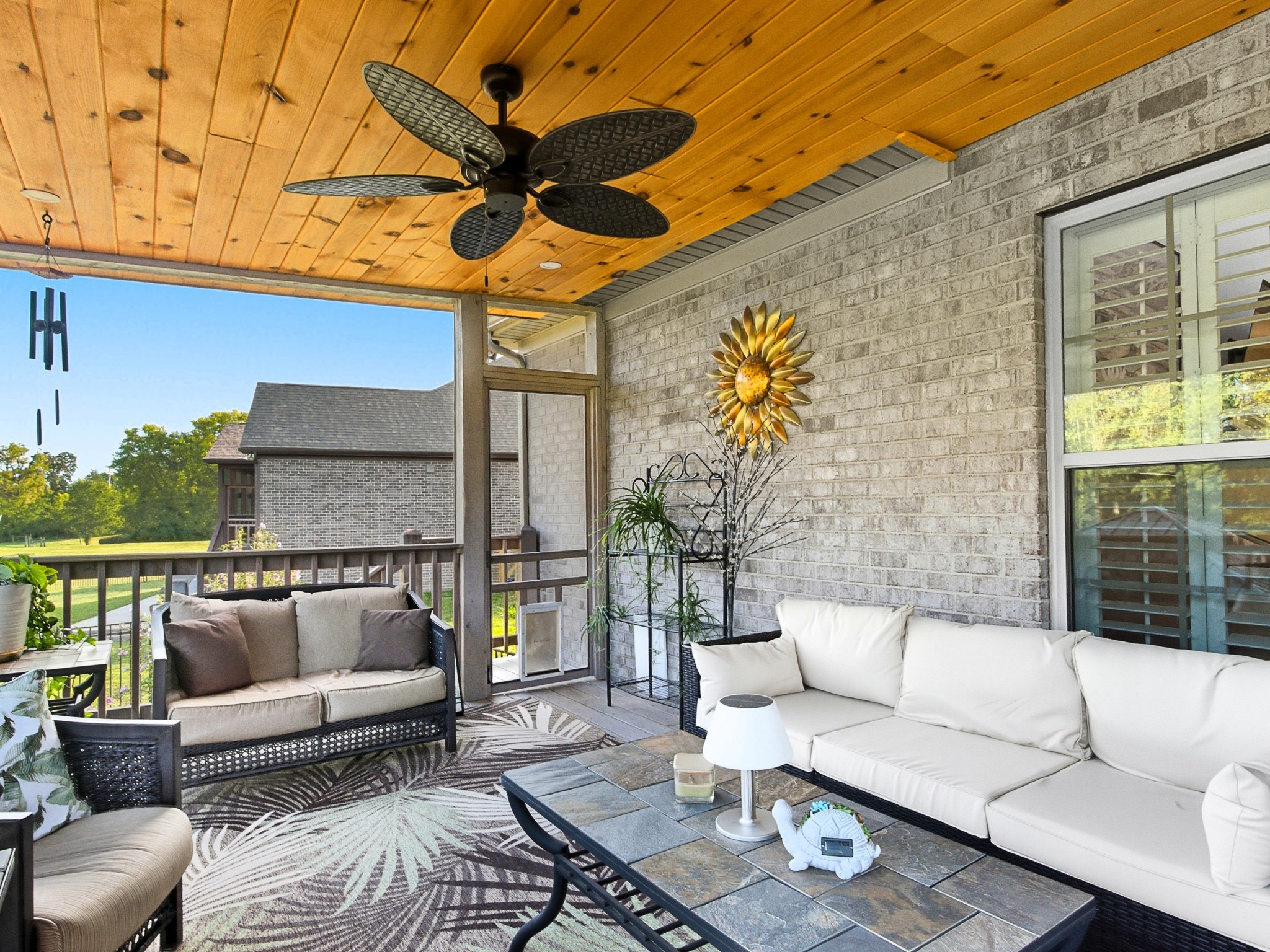 106 Watermill Lane Lebanon, TN 37087 - Photo 72 of 85 a view of a patio with couches and a potted plant on a table