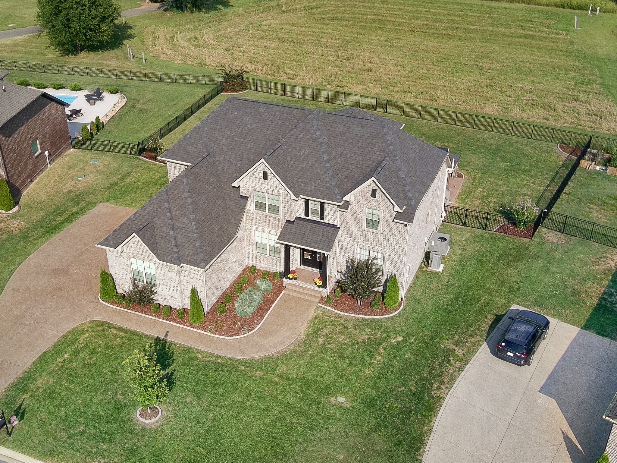106 Watermill Lane Lebanon, TN 37087 - Photo 83 of 85 an aerial view of a house with a garden and lake view