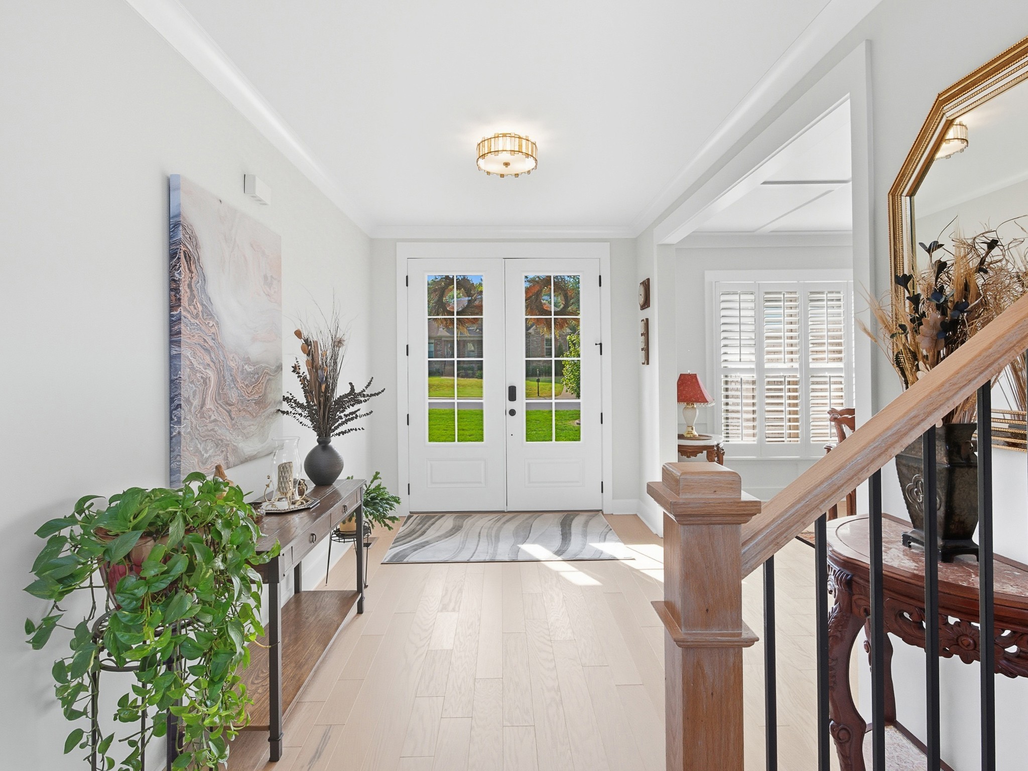 106 Watermill Lane Lebanon, TN 37087 - Photo 9 of 85 a view of an entryway with wooden floor and a potted plant
