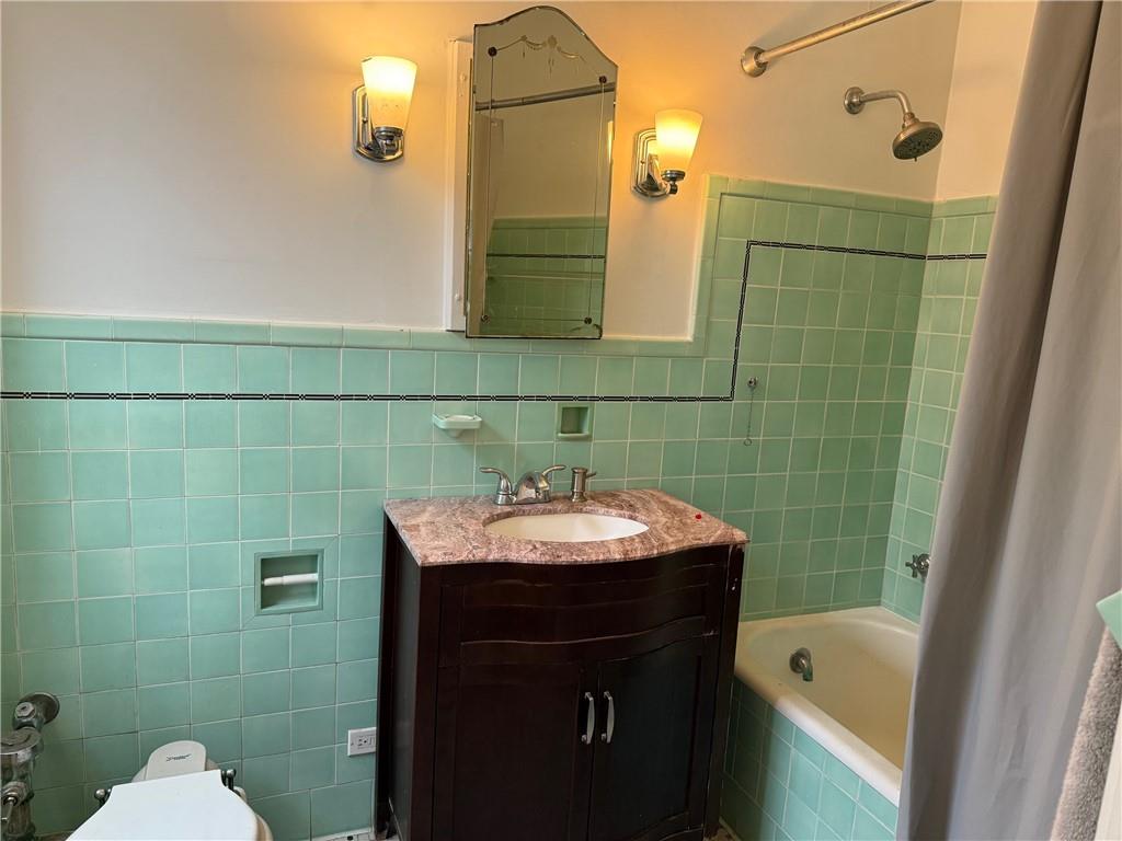 166 North Dithridge Street, Unit 2A Pittsburgh, PA 15213 - Photo 19 of 32 a bathroom with a sink toilet and shower