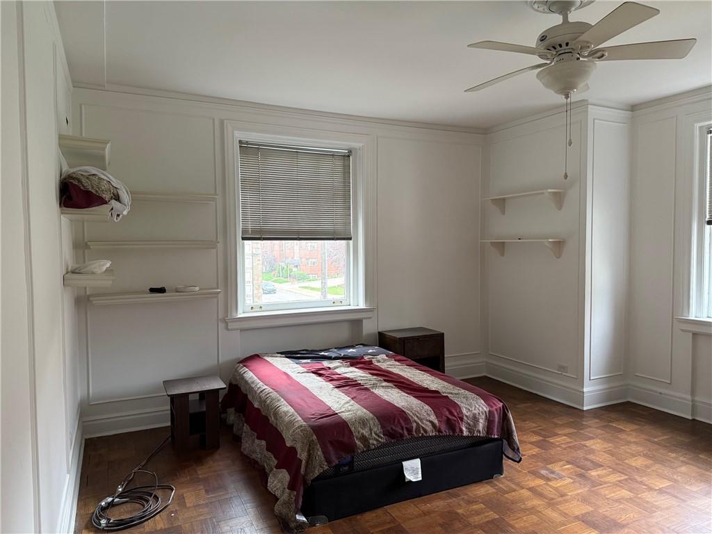 166 North Dithridge Street, Unit 2A Pittsburgh, PA 15213 - Photo 21 of 32 a bedroom with a bed and a window