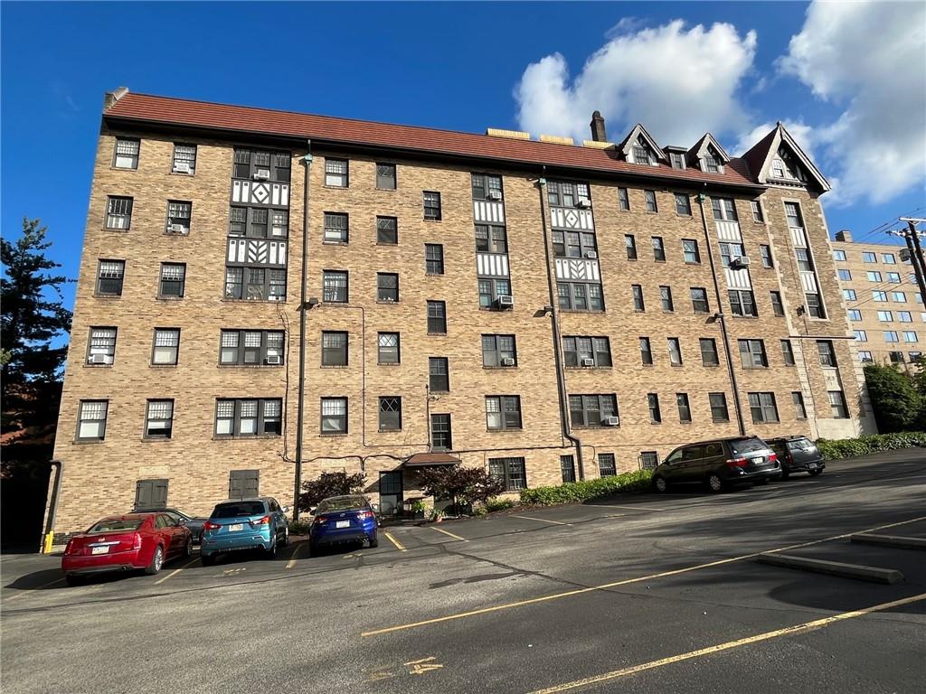 166 North Dithridge Street, Unit 2A Pittsburgh, PA 15213 - Photo 32 of 32 a view of a building and car parked on the side of road