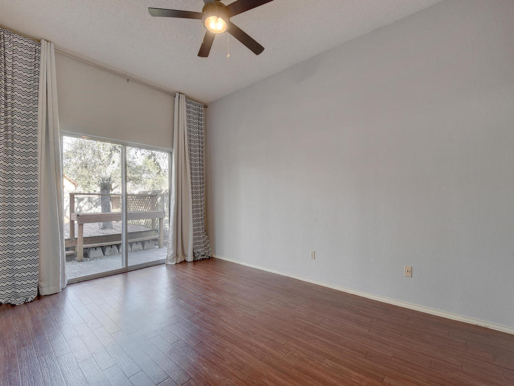 3019 Rochelle Drive Austin, TX 78748 - Photo 12 of 21 an empty room with wooden floor and windows