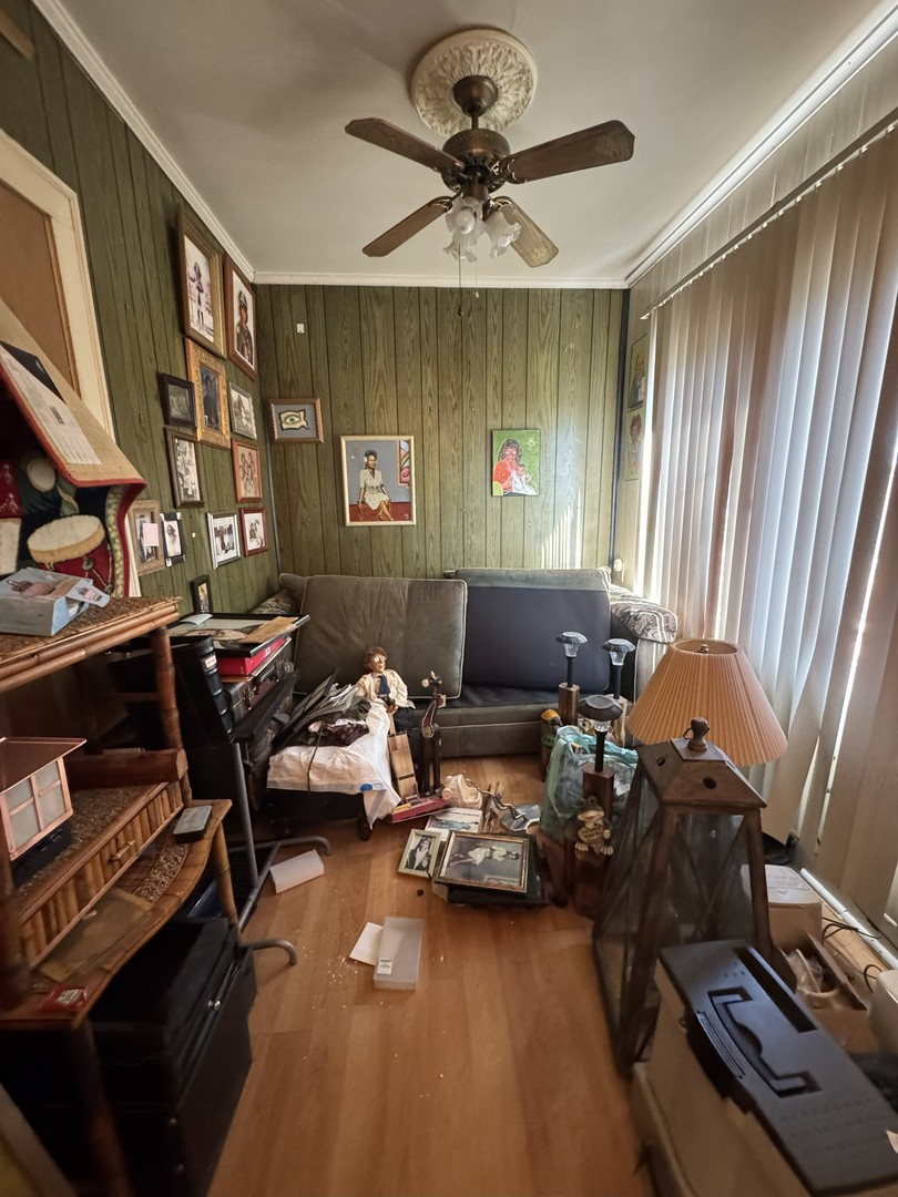 8239 South Ridgeland Avenue Chicago, IL 60617 - Photo 5 of 16 a living room with furniture and a window