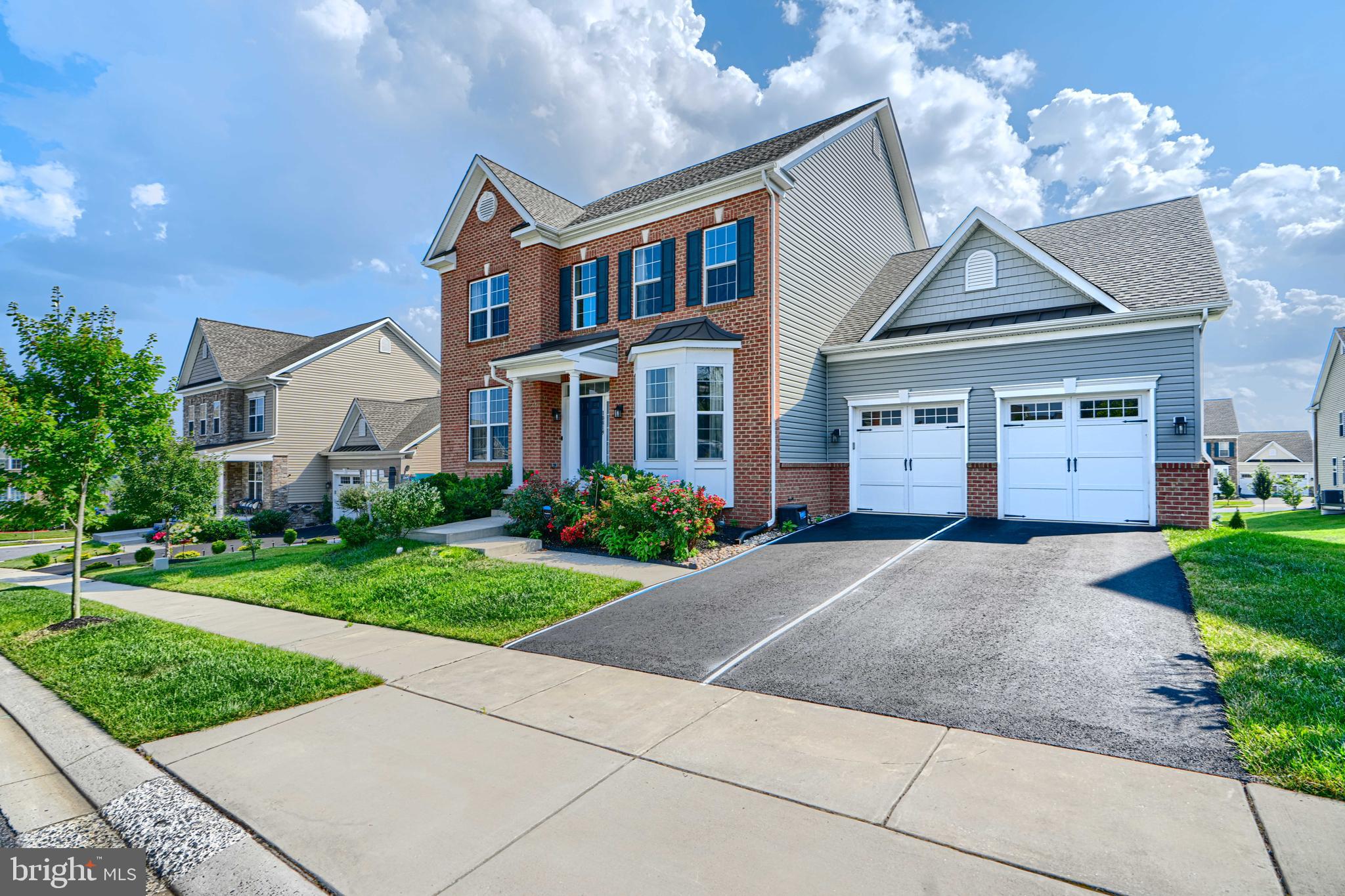 10819 White Trillium Road Perry Hall, MD 21128 - Photo 1 of 47 a front view of a house with a yard and garage
