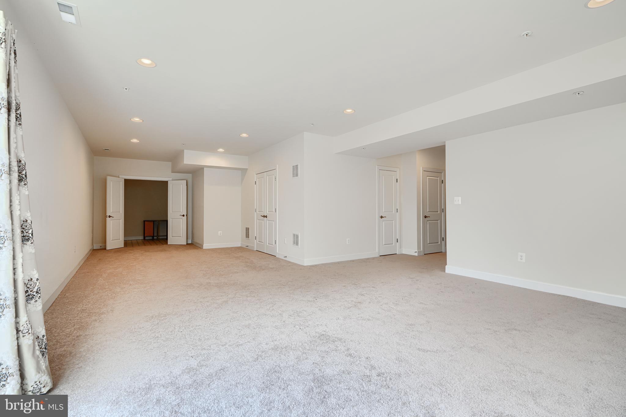 10819 White Trillium Road Perry Hall, MD 21128 - Photo 36 of 47 a view of an empty room with a kitchen