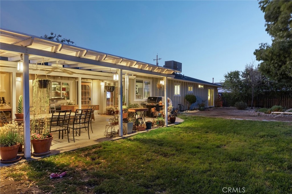 5070 Jardine Road Paso Robles, CA 93446 - Photo 1 of 1 a view of a house with backyard sitting area and garden