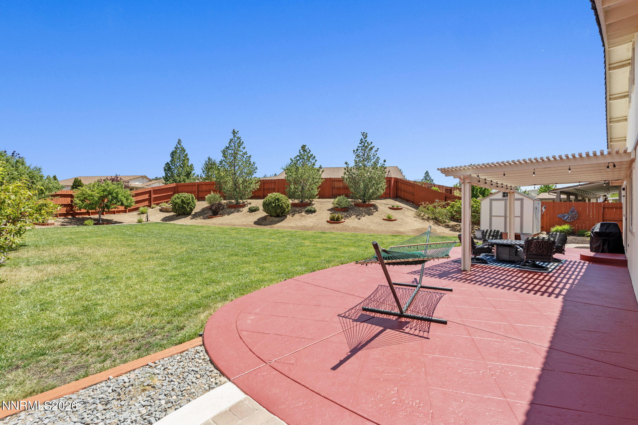 18324 Panda Bear Court Reno, NV 89508 - Photo 26 of 44 a view of a backyard with sitting area