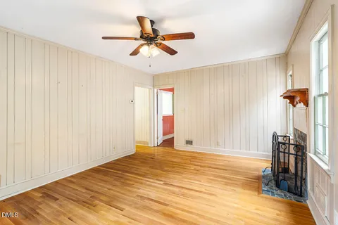 a view of a room with a ceiling fan