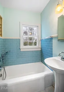 a bathroom with a sink and a bathtub