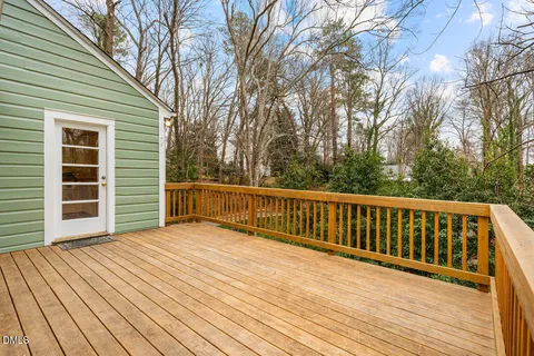 a view of backyard with a deck
