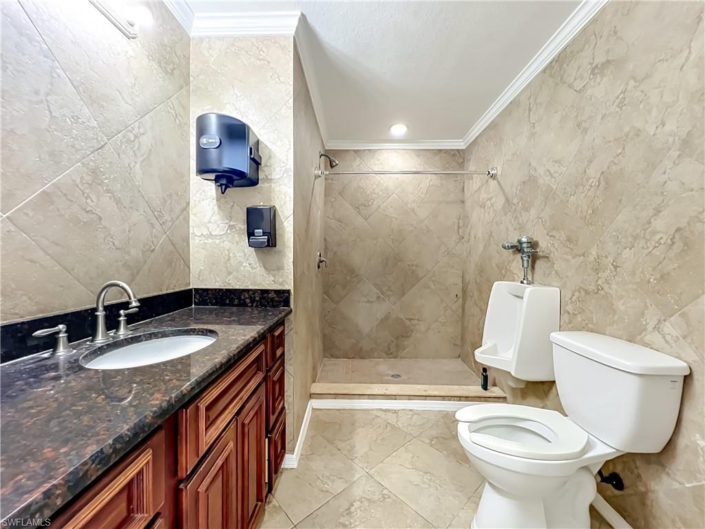 4200 South Hiawassee Road Orlando, FL 32835 - Photo 20 of 47 a bathroom with a granite countertop toilet sink and mirror