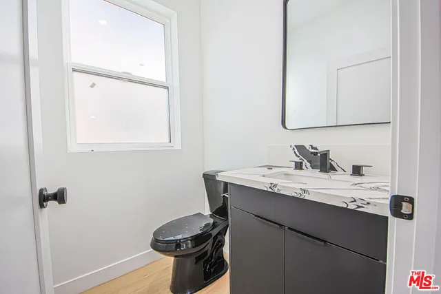 a view of livingroom with hardwood floor and a ceiling fan