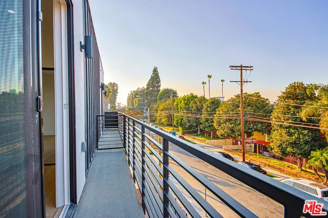 a kitchen with counter top space and wooden floor