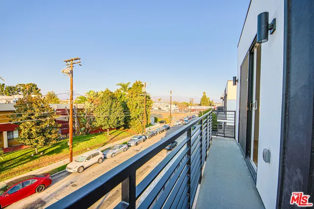 a kitchen with stainless steel appliances granite countertop a sink and a refrigerator