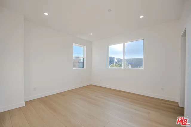 a bathroom with a toilet sink and shower