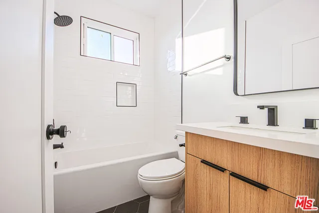 a view of a kitchen with a washer and dryer