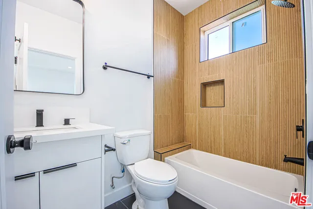 a bathroom with a sink a toilet and a bathtub