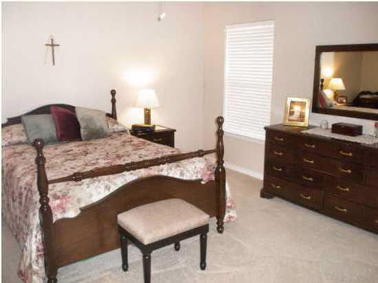 7564 Loop Street Navarre, FL 32566 - Photo 10 of 15 Master Suite With Custom Desiogned "Trey" Ceiling And "His" And "Her" Walk In Closets