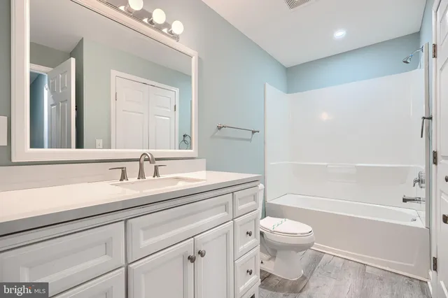 a bathroom with a toilet a sink and a bathtub
