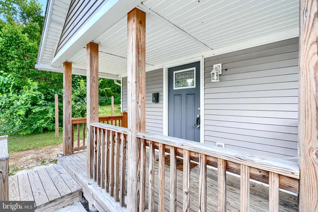 a view of a two chairs with wooden fence