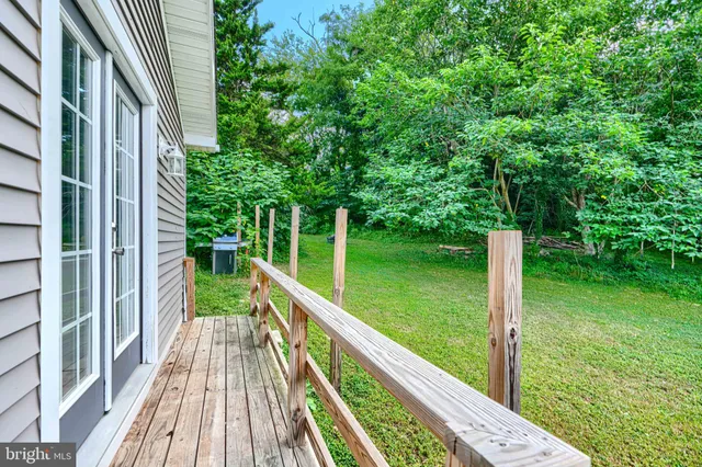 a view of balcony with a garden and trees
