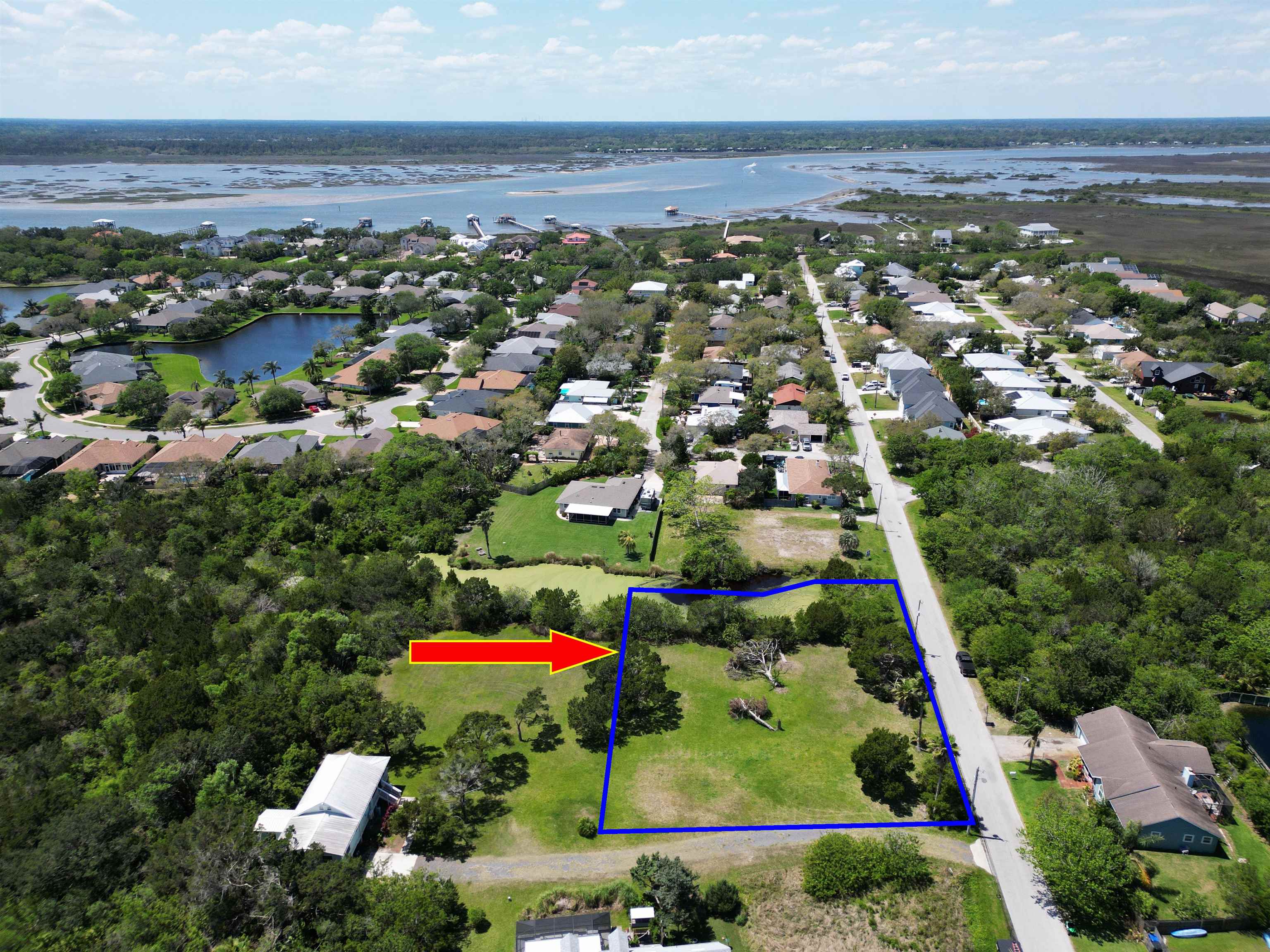 267 Trade Wind Lane St. Augustine, FL 32080 - Photo 11 of 14 an aerial view of residential houses with outdoor space and trees