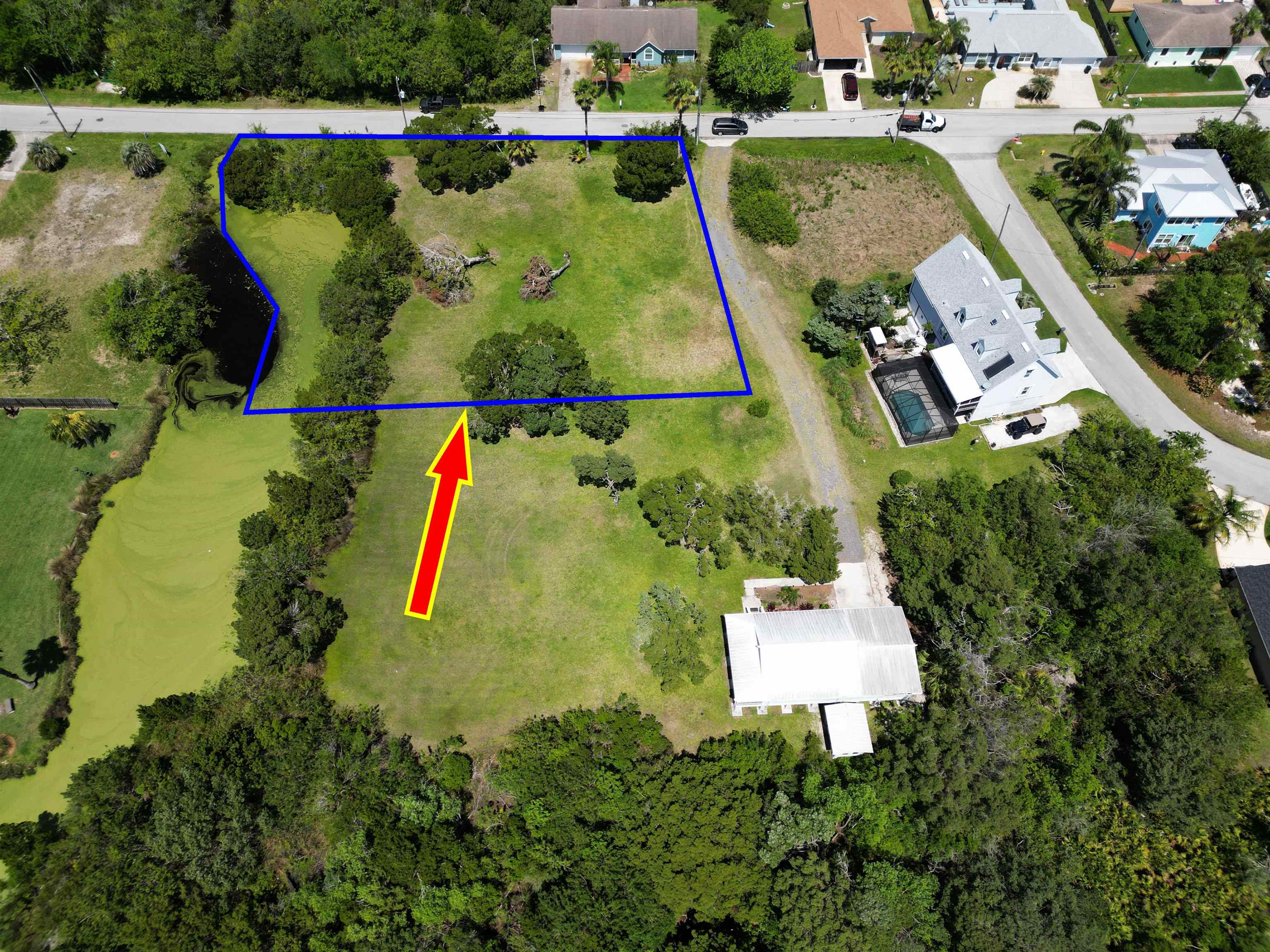 267 Trade Wind Lane St. Augustine, FL 32080 - Photo 5 of 14 an aerial view of a house with a garden and swimming pool