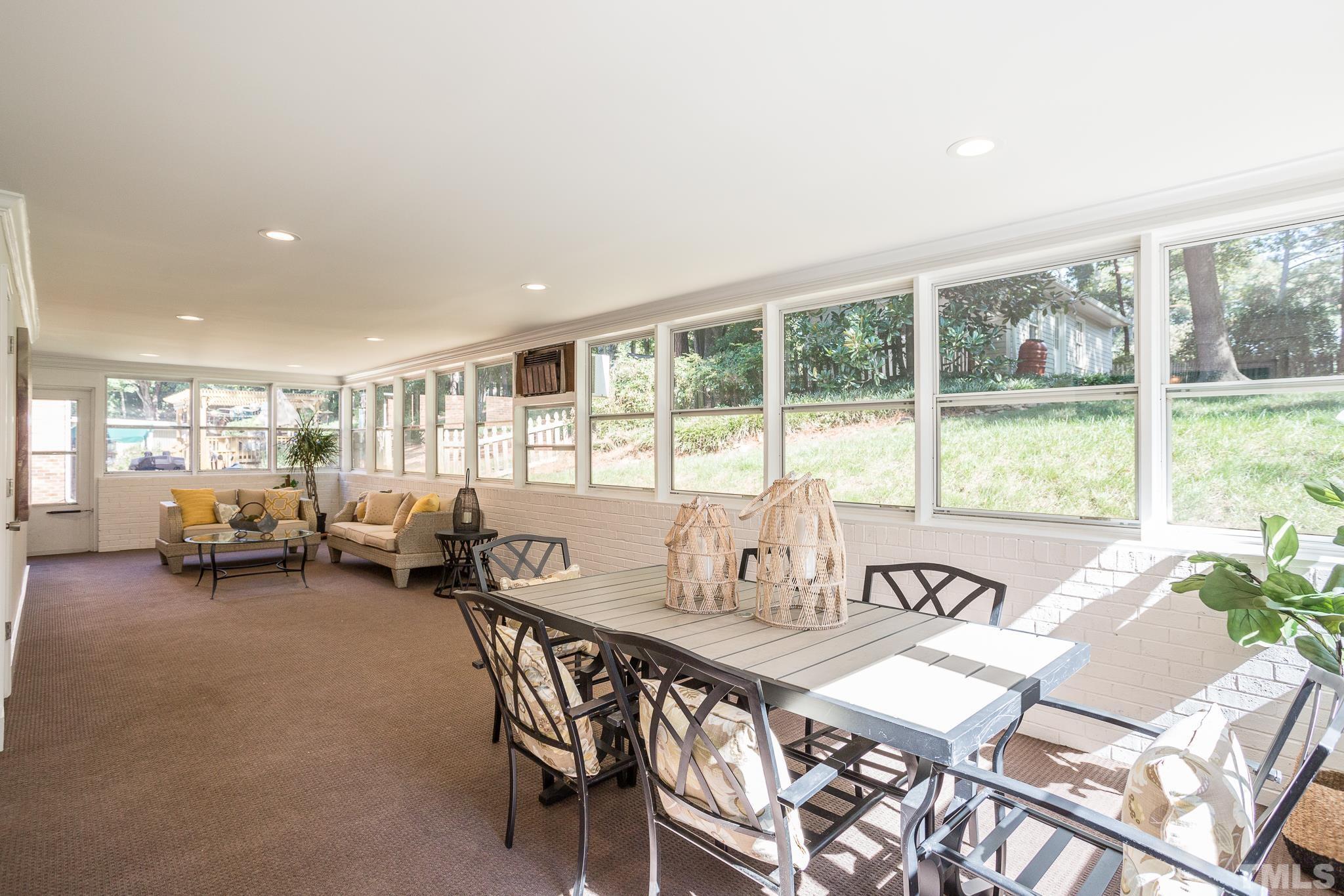 4608 Oak Park Road Raleigh, NC 27612 - Photo 13 of 30 a view of a dining room with furniture window and outside view