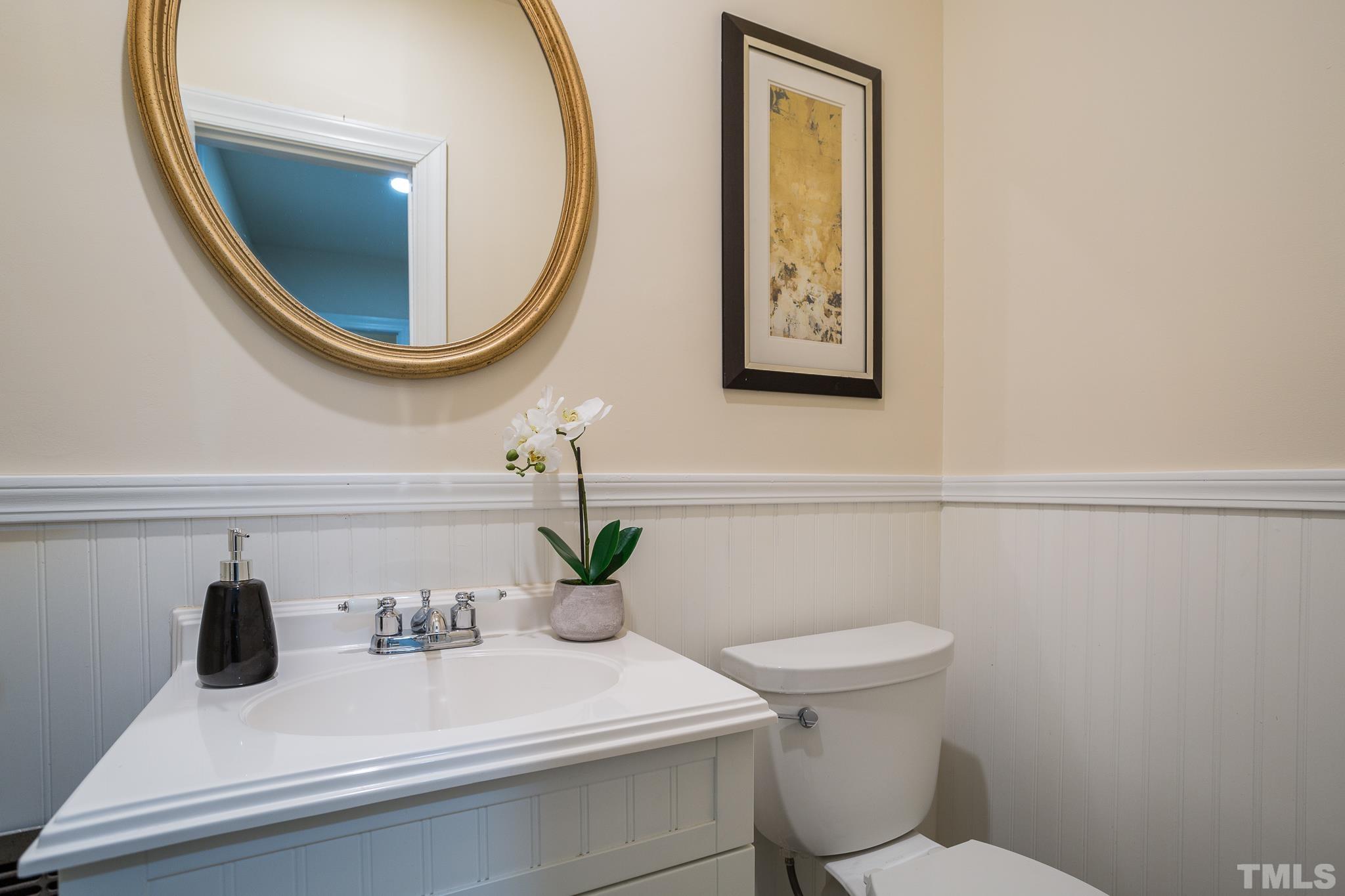4608 Oak Park Road Raleigh, NC 27612 - Photo 16 of 30 a bathroom with a sink and a mirror