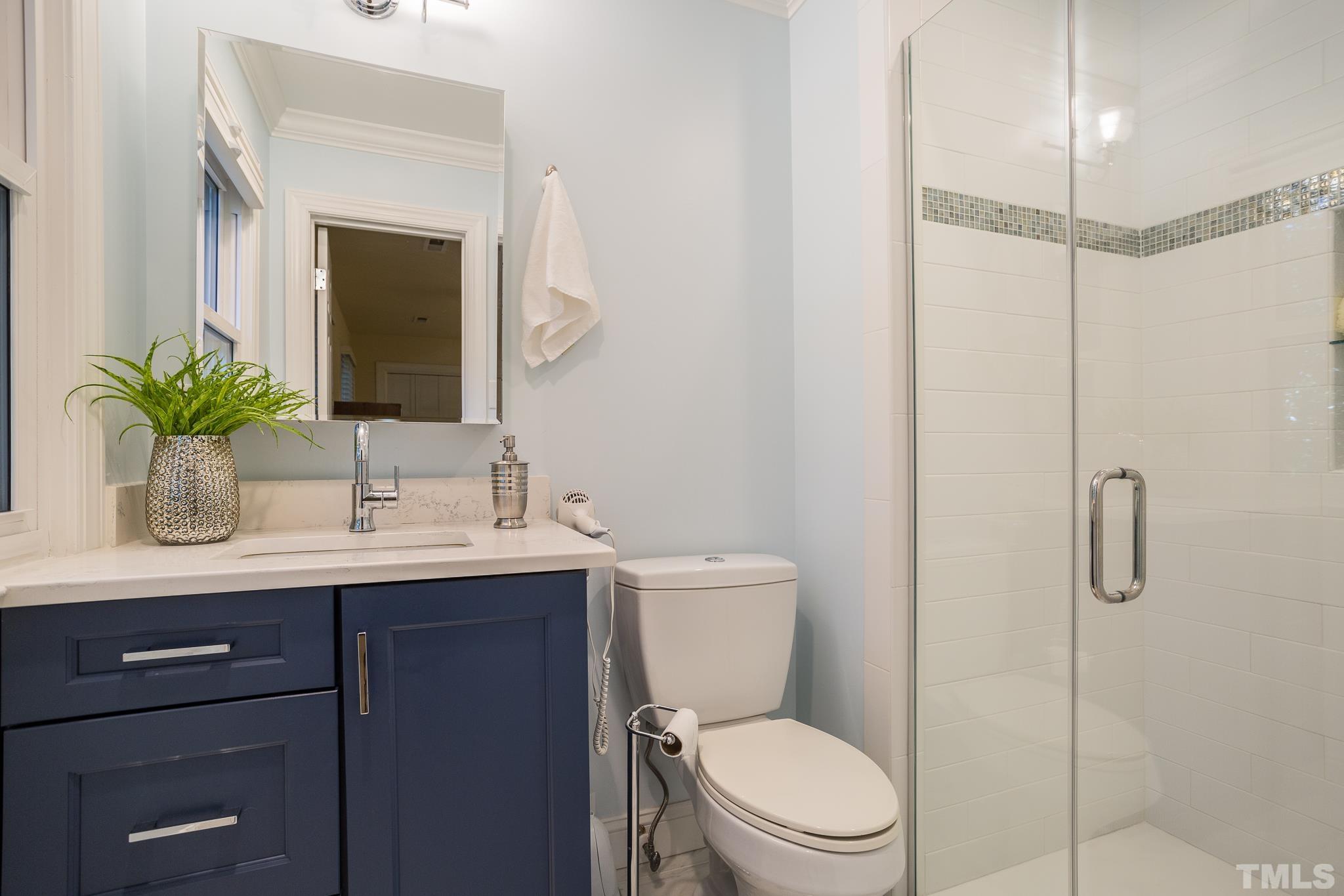 4608 Oak Park Road Raleigh, NC 27612 - Photo 20 of 30 a bathroom with a toilet sink and shower