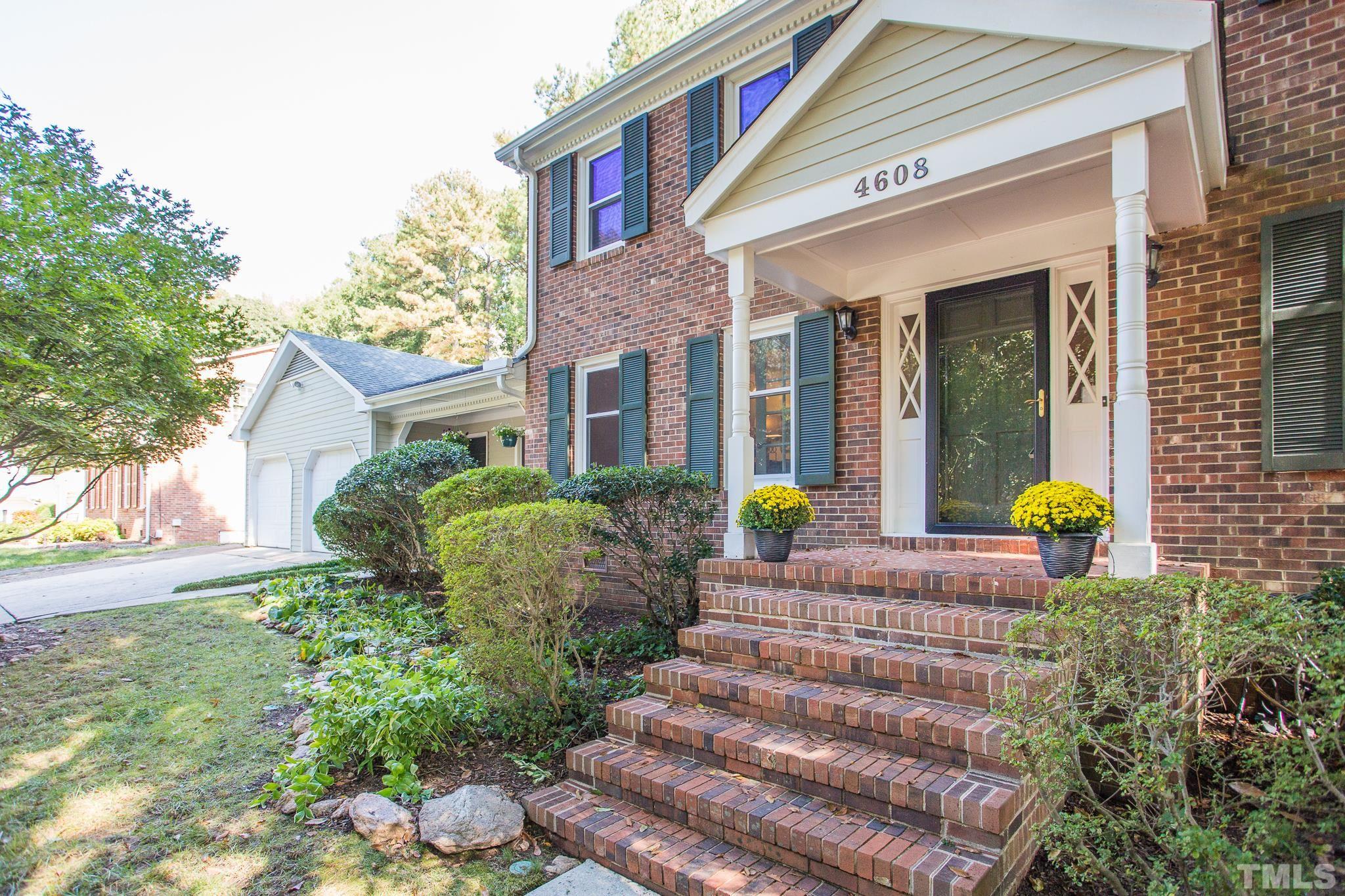 4608 Oak Park Road Raleigh, NC 27612 - Photo 3 of 30 a front view of a house with a garden