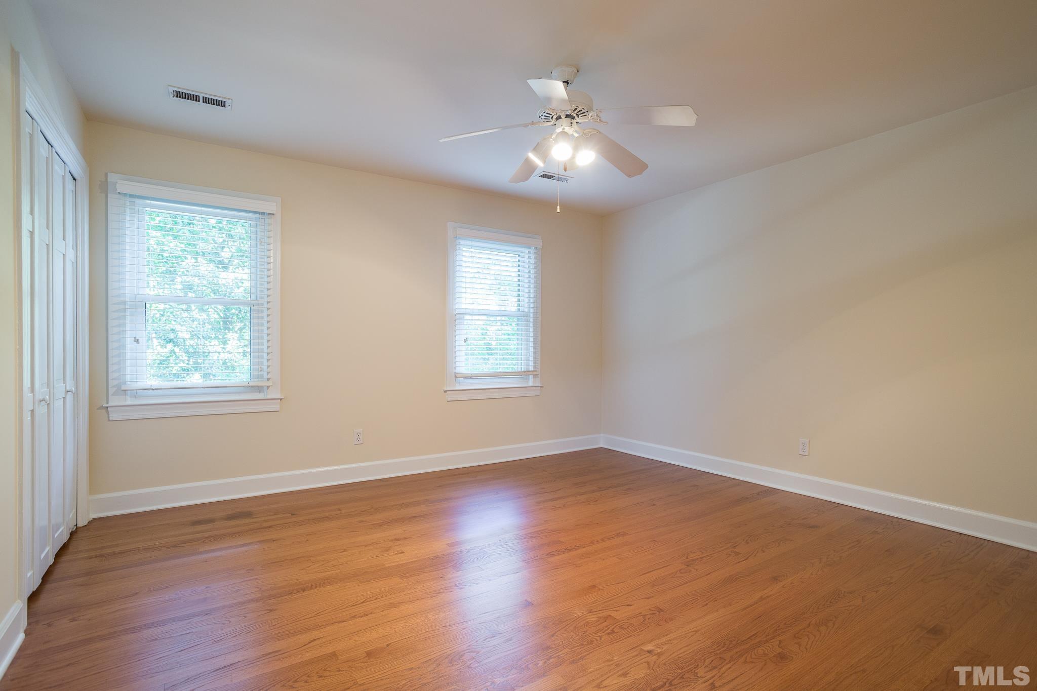 4608 Oak Park Road Raleigh, NC 27612 - Photo 24 of 30 a view of an empty room with wooden floor and a window