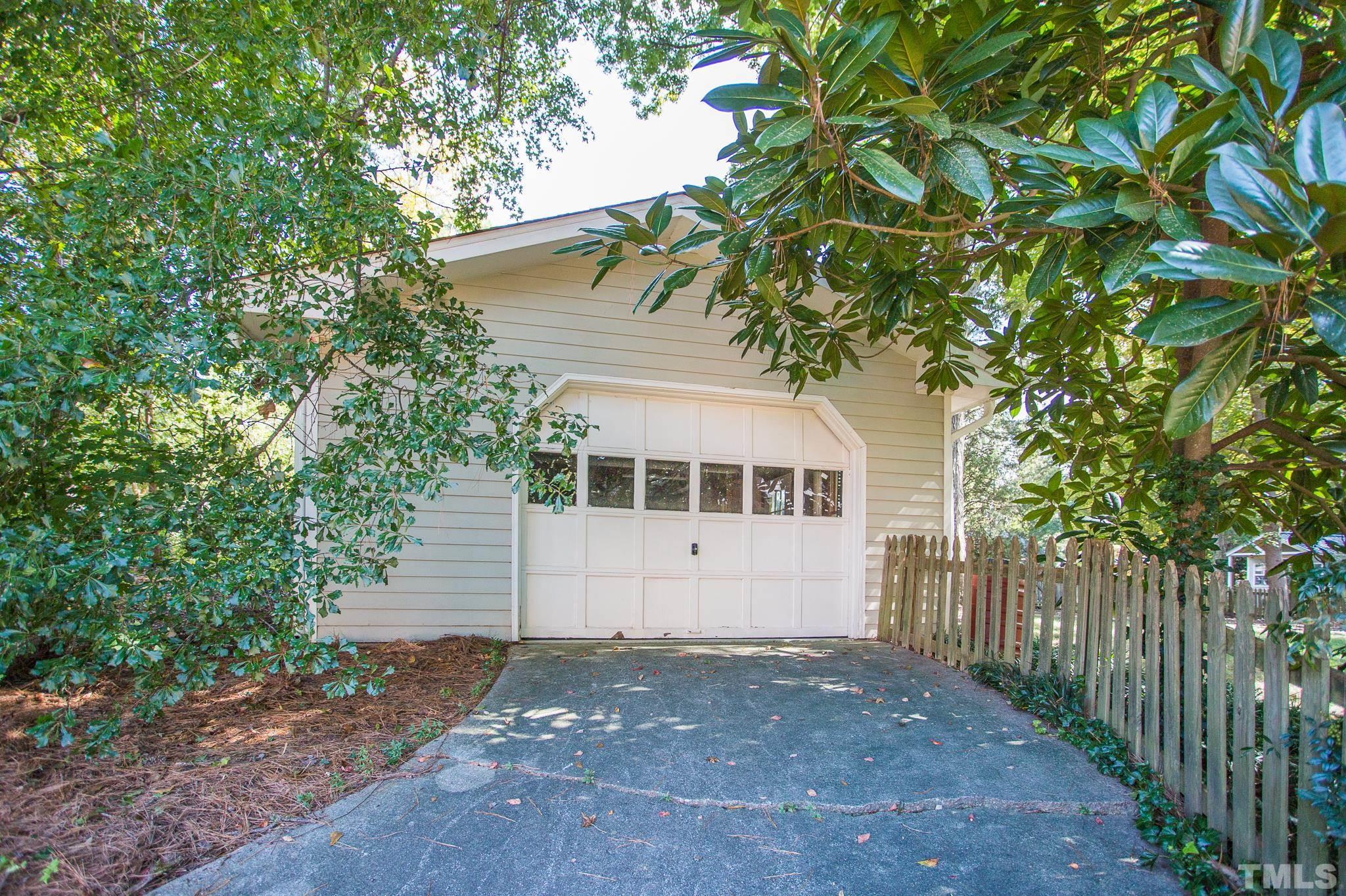 4608 Oak Park Road Raleigh, NC 27612 - Photo 25 of 30 a front view of a house with a yard