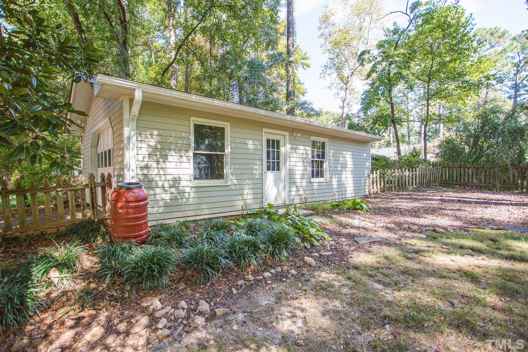 4608 Oak Park Road Raleigh, NC 27612 - Photo 26 of 30 a front view of a house with a yard