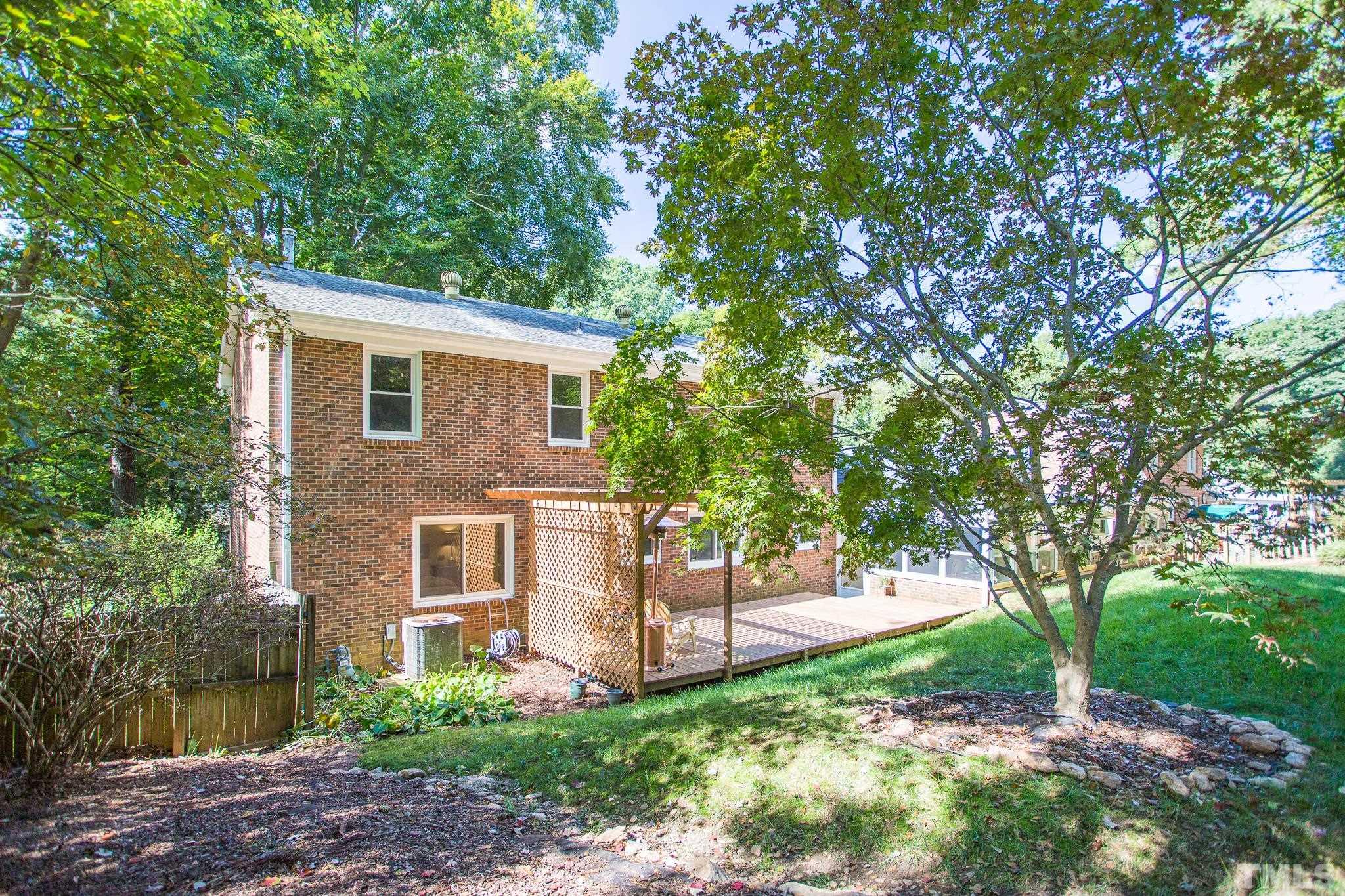 4608 Oak Park Road Raleigh, NC 27612 - Photo 27 of 30 a front view of a house with garden