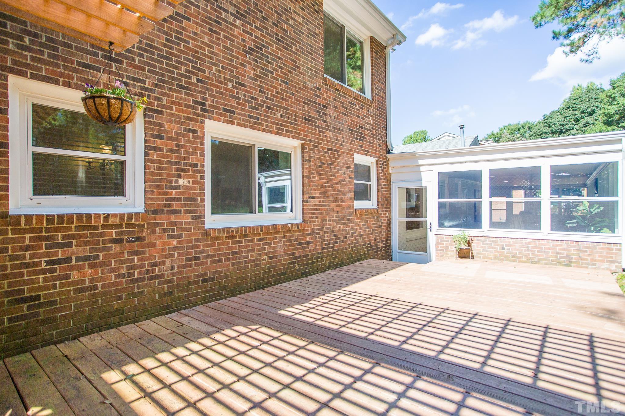 4608 Oak Park Road Raleigh, NC 27612 - Photo 30 of 30 a view of a brick house with many windows