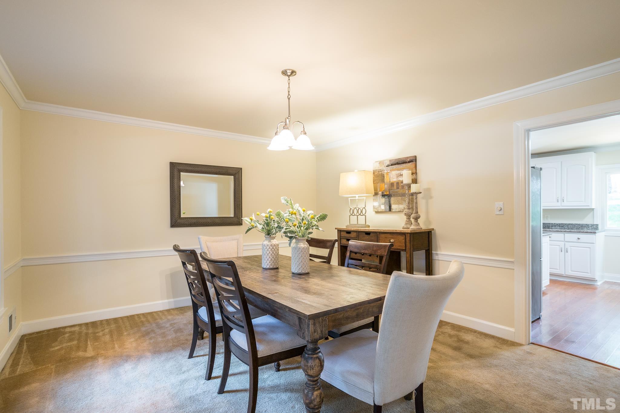 4608 Oak Park Road Raleigh, NC 27612 - Photo 6 of 30 a view of a dining room with furniture