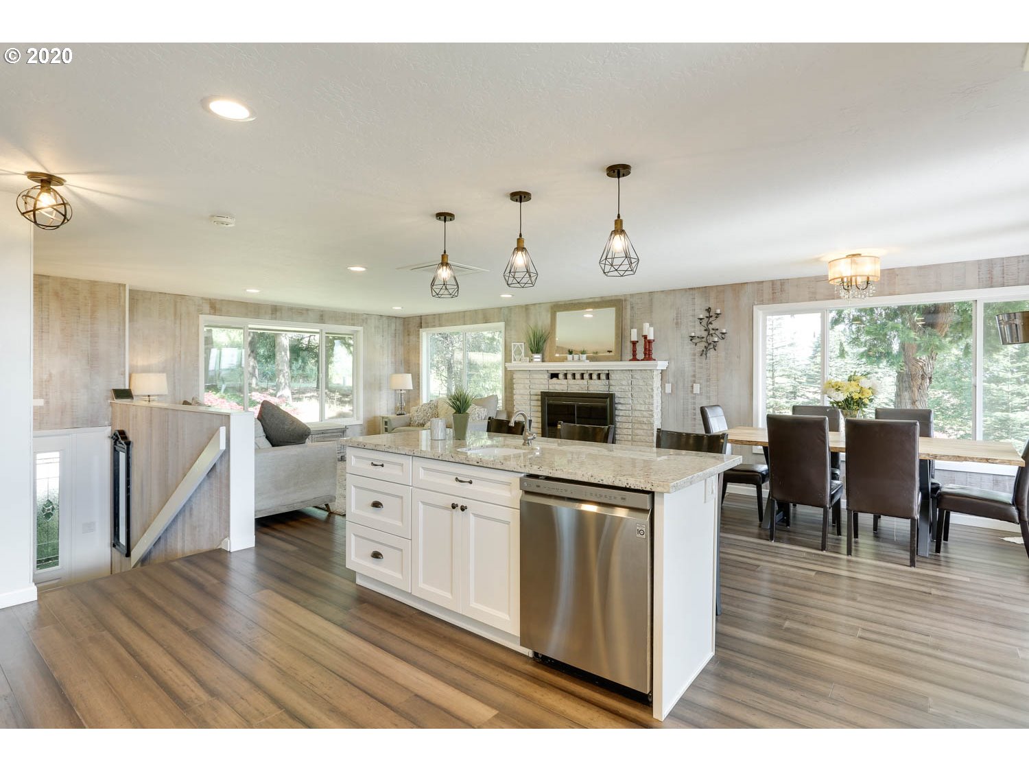 33672 Southwest Laurel Road Hillsboro, OR 97123 - Photo 11 of 32 a kitchen with white cabinets appliances and wooden floor
