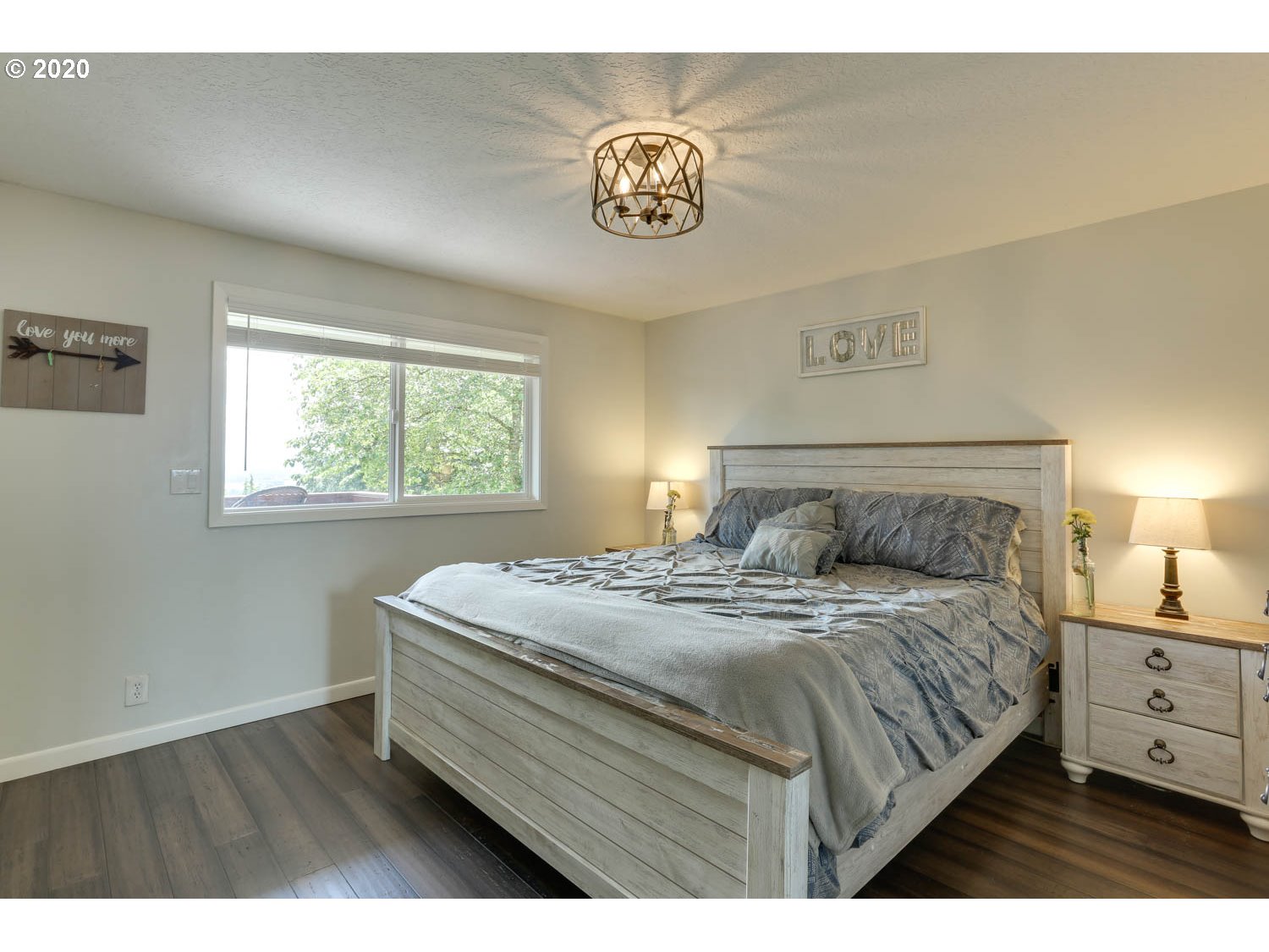 33672 Southwest Laurel Road Hillsboro, OR 97123 - Photo 12 of 32 a bedroom with a bed and a window