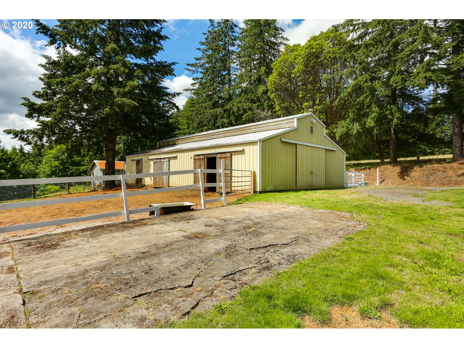 33672 Southwest Laurel Road Hillsboro, OR 97123 - Photo 24 of 32 a view of a yard with a house and a large tree