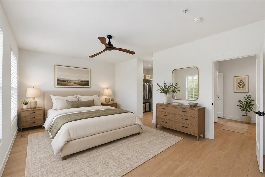 504 South O Connor Road Irving, TX 75060 - Photo 14 of 25 Bedroom featuring light wood-finish flooring and a ceiling fan with wood-tone blades